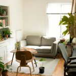 Living room corner styled with tall indoor plants